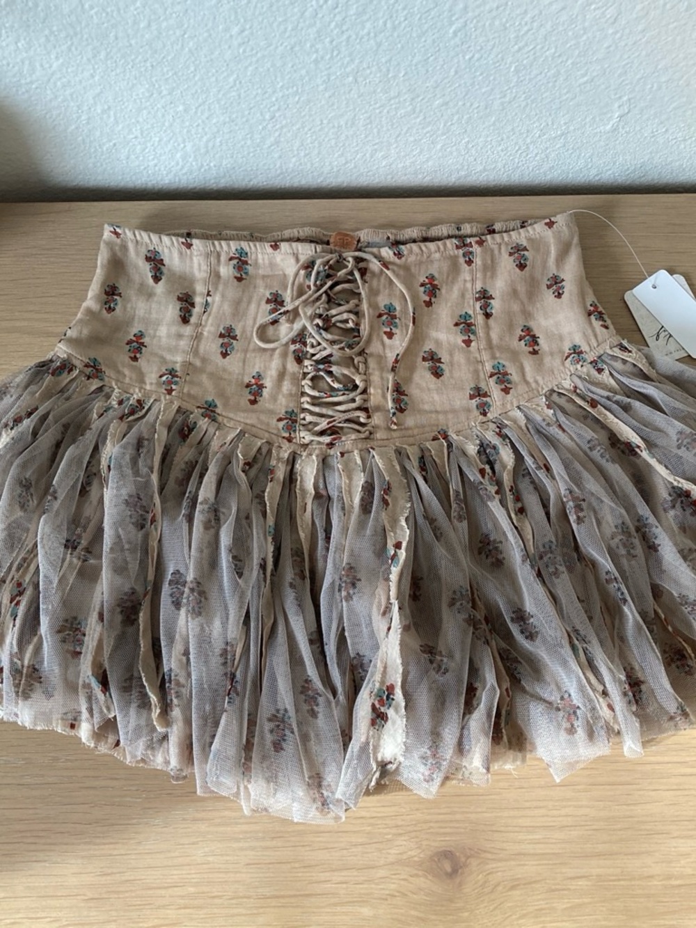 Free People One Blossom Brown Floral Lace-Up Tiered Mini Skort retails for $78